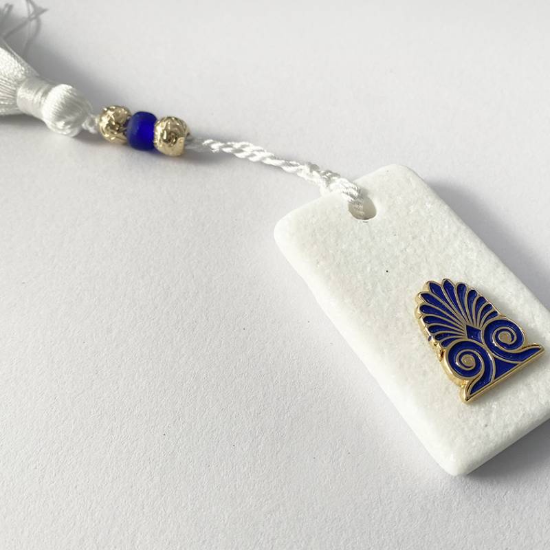 Miniature blue antefix on white marble